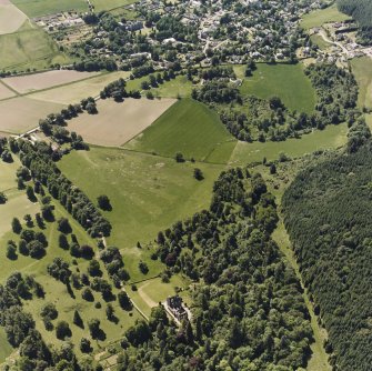 Castle Leod.
Oblique aerial view, taken from the N, centred on the tower-house and  a possible golf course. Strathpeffer is shown in the top of the photograph.