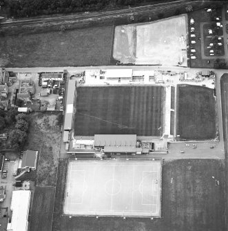 Oblique aerial view centred on the football stadium, taken from the ESE.