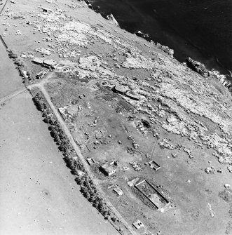 Aerial view of North Sutor, First and Second World War coast batteries from the NW.  Part of the accommodation camp and seachlight battery is also visible.