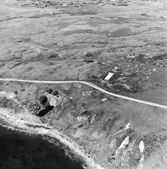 Aerial view of Nigg Second World War coast battery and accommodation camp from the SE.  The two partly demolished gun-emplacements are visible. One of the gun-emplacements has been built into the remains of Dunskeath Castle.