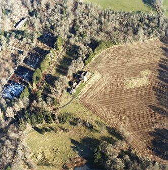 Oblique aerial view centred on the dairy, taken from the WSW.