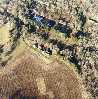 Oblique aerial view centred on the dairy, taken from the SE.