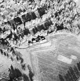 Oblique aerial view centred on the dairy, taken from the SSW.