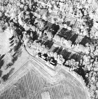 Oblique aerial view centred on the dairy, taken from the SE.