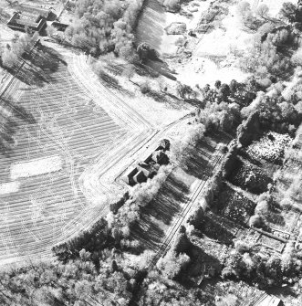 Oblique aerial view centred on the dairy, taken from the NE.