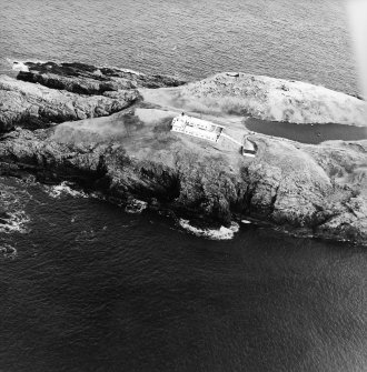 Oblique aerial view centred on the lighthouse, taken from the W.