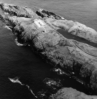 Oblique aerial view centred on the lighthouse, taken from the SSW.