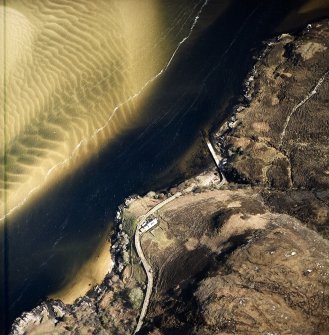 Oblique aerial view centred on the house, enclosure and jetty, taken from the W.