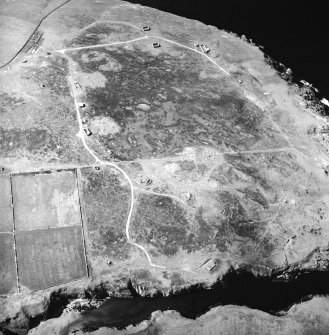 Oblique aerial view centred on the remains of the radar station, taken from the ESE.