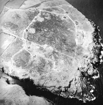 Oblique aerial view centred on the remains of the radar station, taken from the E.