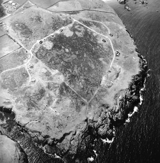 Oblique aerial view centred on the remains of the radar station, taken from the ENE.