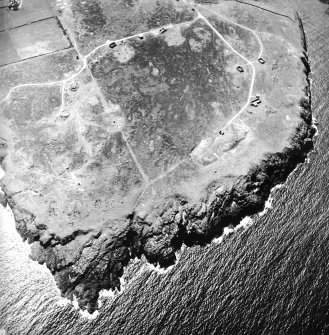 Oblique aerial view centred on the remains of the radar station, taken from the NE.