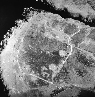Oblique aerial view centred on the remains of the radar station, taken from the W.