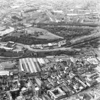 Aerial view showing Canongate at bottom of photograph, St Andrew's House at left, Leith Walk at top and Regent Terrace at right, plus Calton Hill in centre