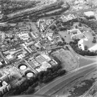 Aerial view of Canongate, also showing Regent Terrace at top of photograph, Holyrood Palace and Abbey to right, Holyrood Road, Meadow Flat Gas Holder Station at bottom, and Canongate heading to left