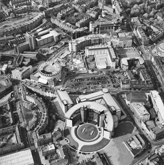 Oblique aerial view of Edinburgh centred on the Scottish Widows building with the Exchange area visible in the background, taken from the S.