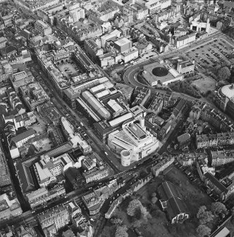 Oblique aerial view of Edinburgh centred on the Royal Museum of Scotland, taken from the NW.