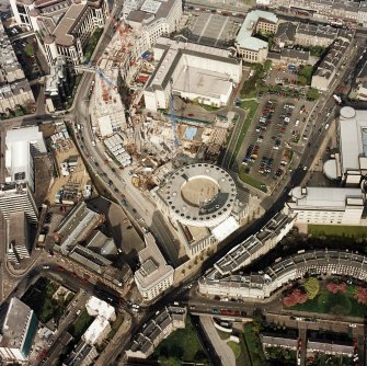 Oblique aerial view of Edinburgh centred on the construction of Exchange Crescent with the Edinburgh International Conference Centre adjacent, taken from the WSW.