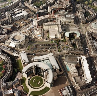 Oblique aerial view of Edinburgh centred on the Scottish Widows office building, Morrison Street, with the EICC and the construction of Exchange Crescent in the background, taken from the S.