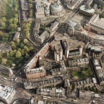 Oblique aerial view of Edinburgh centred on the Caledonian Hotel and Standard Life building, with Rutland Square adjacent, taken from the NW.