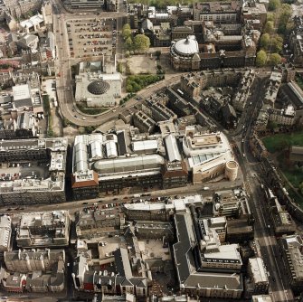 Oblique aerial view of Edinburgh centred on the Museum of Scotland, taken from the N.