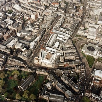 Oblique aerial view of Edinburgh centred on the Museum of Scotland, taken from the SW.