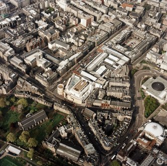 Oblique aerial view of Edinburgh centred on the Museum of Scotland, taken from the SSW.
