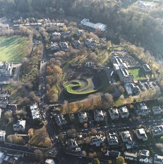 Oblique aerial view of the centred on the construction of the garden and the art gallery and school, taken from the NNW.