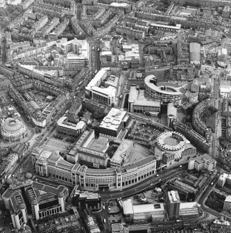 Oblique aerial view centred on The Exchange area of Edinburgh, taken from the NW.