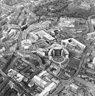 Oblique aerial view centred on The Exchange area of Edinburgh, taken from the SSW.