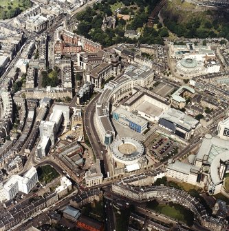 General oblique aerial view centred on the conference centre and The Exchange area with the houses adjacent, taken from the SW.
