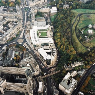 Oblique aerial view of Edinburgh centred on the Omni Plaza complex including the Calton Square development and St Mary's Cathedral, taken from the SE.