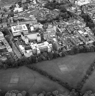 Oblique aerial view centred on the hospital with the school adjacent, taken from the SSW.