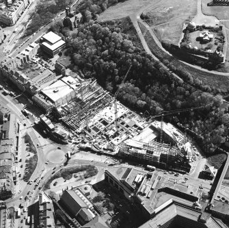 Oblique aerial view centred on the construction of the Omni Plaza with the observatory adjacent, taken from the W.