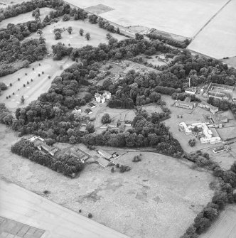 Oblique aerial view centred on the house and the hospital before development, taken from the SE.