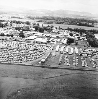 General oblique aerial view centred on the exhibition centre, taken from the NW.