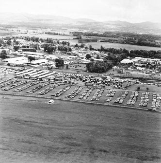 General oblique aerial view centred on the exhibition centre, taken from the NW.