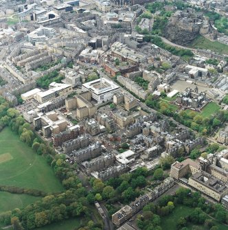 Oblique aerial view centred on the hospital with the chapel, hospital and school adjacent, taken from the ESE.