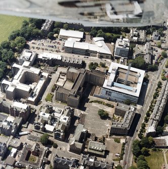 Oblique aerial view centred on the hospital, taken from the ENE.