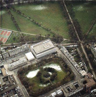 Oblique aerial view centred on the library with George Square, University buildings and Meadows adjacent, taken from the N.