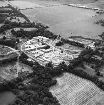 Oblique aerial view centred on the office under construction, taken from the SE.