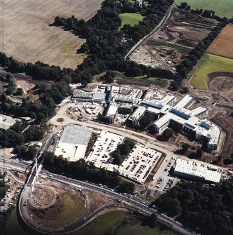 Oblique aerial view centred on the Royal Bank of Scotland headquarters under construction, taken from the NW.