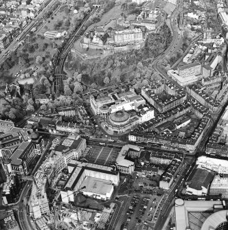 Oblique aerial view of Edinburgh centred on the Usher Hall with Edinburgh Castle behind, taken from the SW.