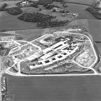 Oblique aerial view centred on the Royal Infirmary of Edinburgh at Little France under construction, taken from the SE.
