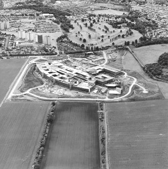 Oblique aerial view centred on the hospital under construction, taken from the NE.