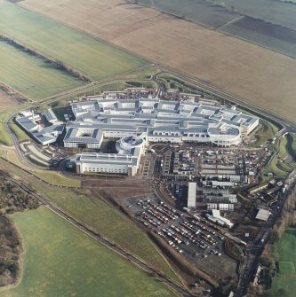 Oblique aerial view centred on the hospital, taken from the W.
