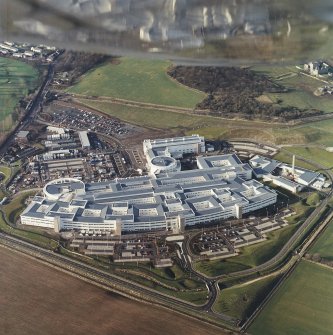 Oblique aerial view centred on the hospital, taken from the E.