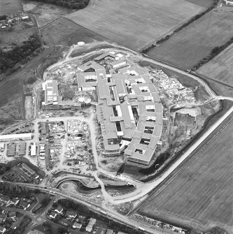 Oblique aerial view centred on the hospital under construction, taken from the S.