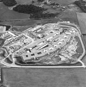 Oblique aerial view centred on the hospital under construction, taken from the SE.