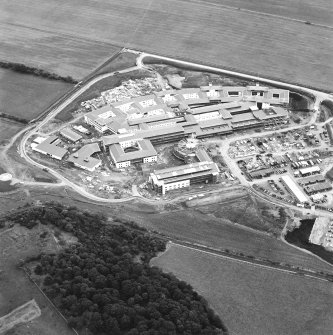 Oblique aerial view centred on the hospital under construction, taken from the WNW.